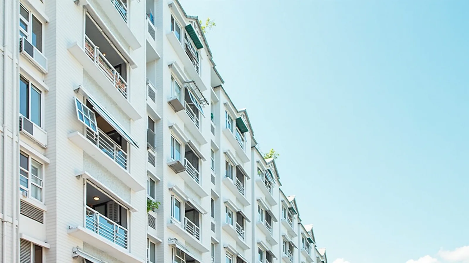 Facade of a Singapore HDB block showing rows of white aluminium casement and sliding windows