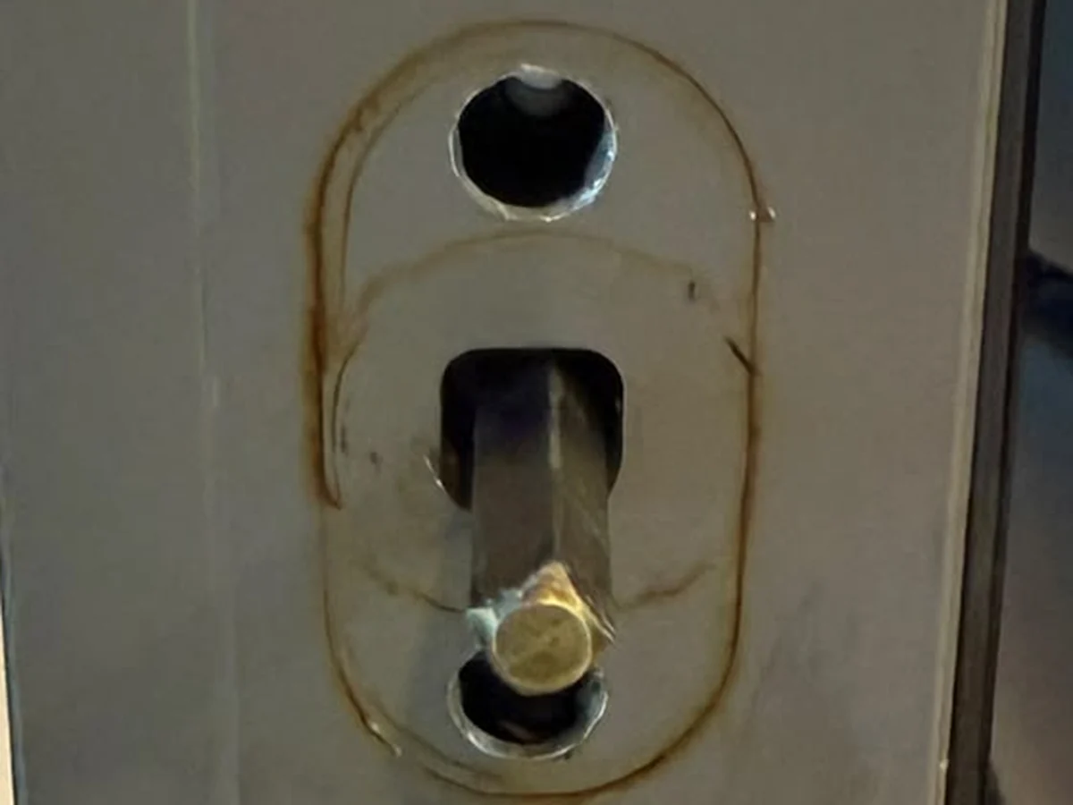 Square spindle exposed on an aluminium window sash with the handle removed